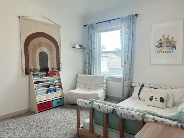 a living room with furniture and a window