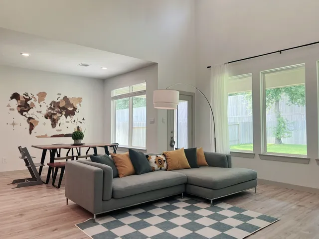 a living room with furniture and a large window