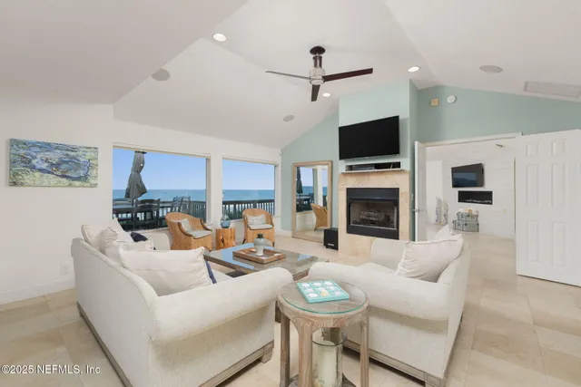 a bedroom with a bed a couch and a window