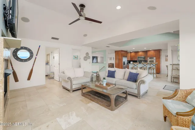 a bedroom with furniture and a potted plant