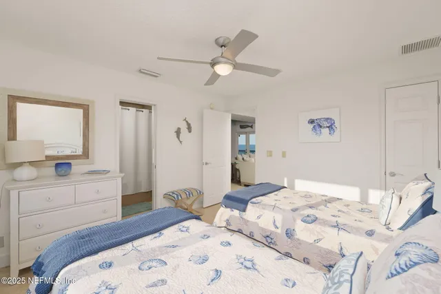 a living room with furniture and a kitchen