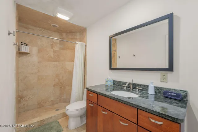 a chair and table in a backyard of a house