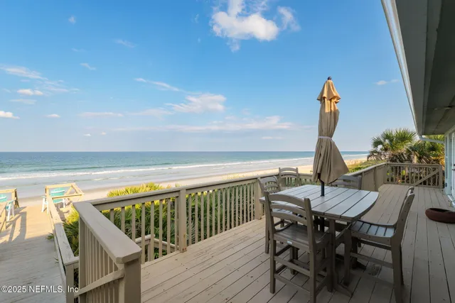 a view of a balcony with wooden floor