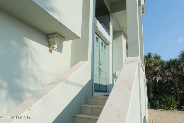 a living room with lots of furniture and kitchen view
