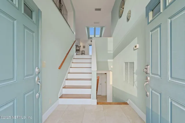 a dinning room with chairs and tables with kitchen view