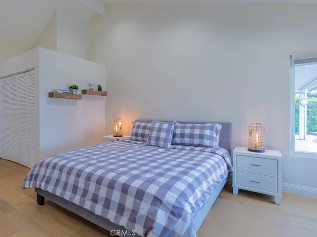 a bedroom with a bed and a closet