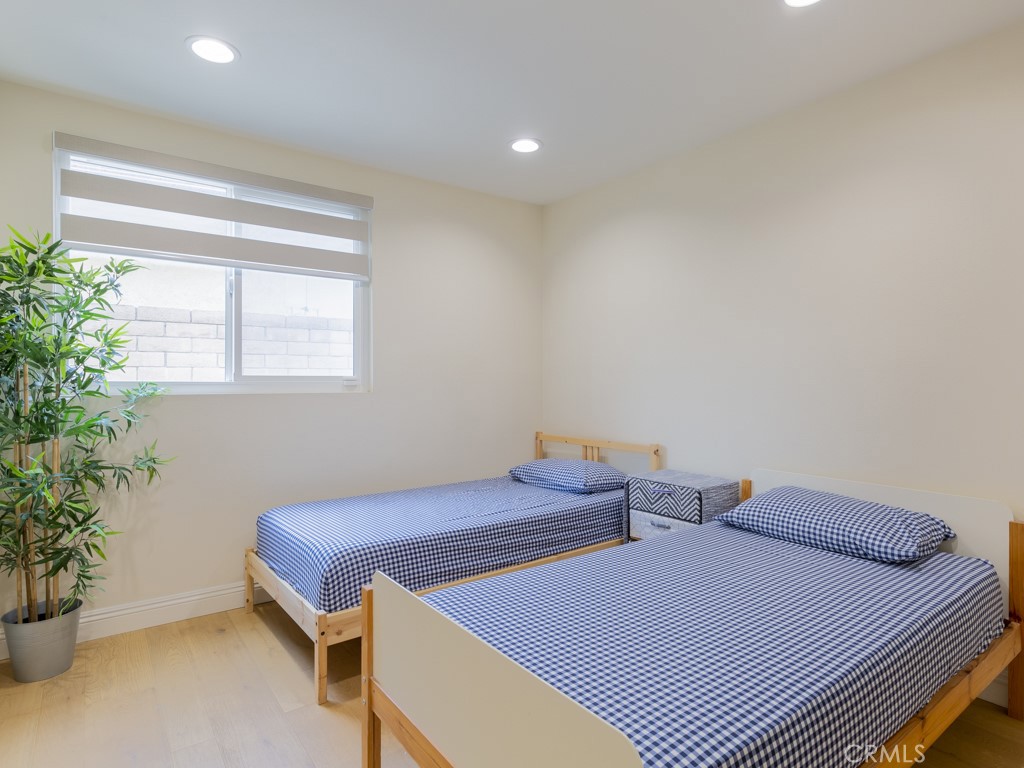 3305 Hawkwood Road Diamond Bar, CA 91765 - Photo 27 of 32 a bedroom with two beds and potted plant