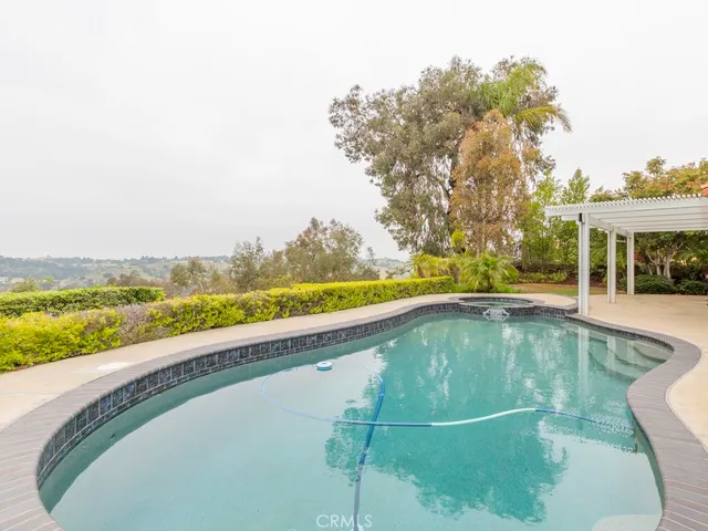 a view of a swimming pool with a balcony