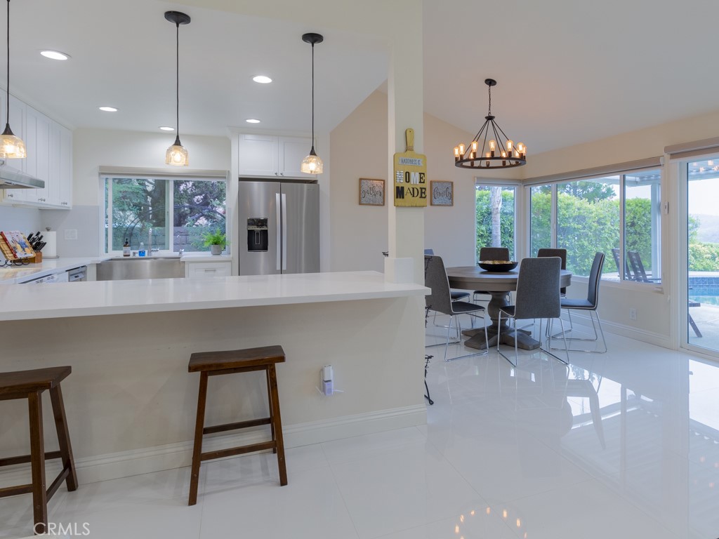 3305 Hawkwood Road Diamond Bar, CA 91765 - Photo 9 of 32 a large kitchen with a table and chairs