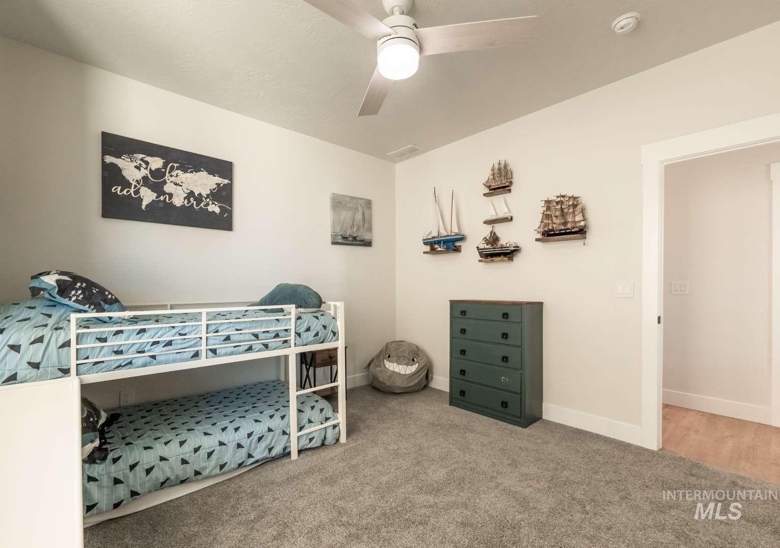 9853 Salmon Ridge Place Nampa, ID 83686 - Photo 24 of 48 Carpeted bedroom with ceiling fan and baseboards
