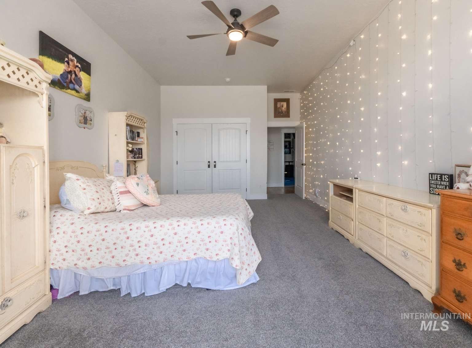 9853 Salmon Ridge Place Nampa, ID 83686 - Photo 31 of 48 Carpeted bedroom with a closet and a ceiling fan