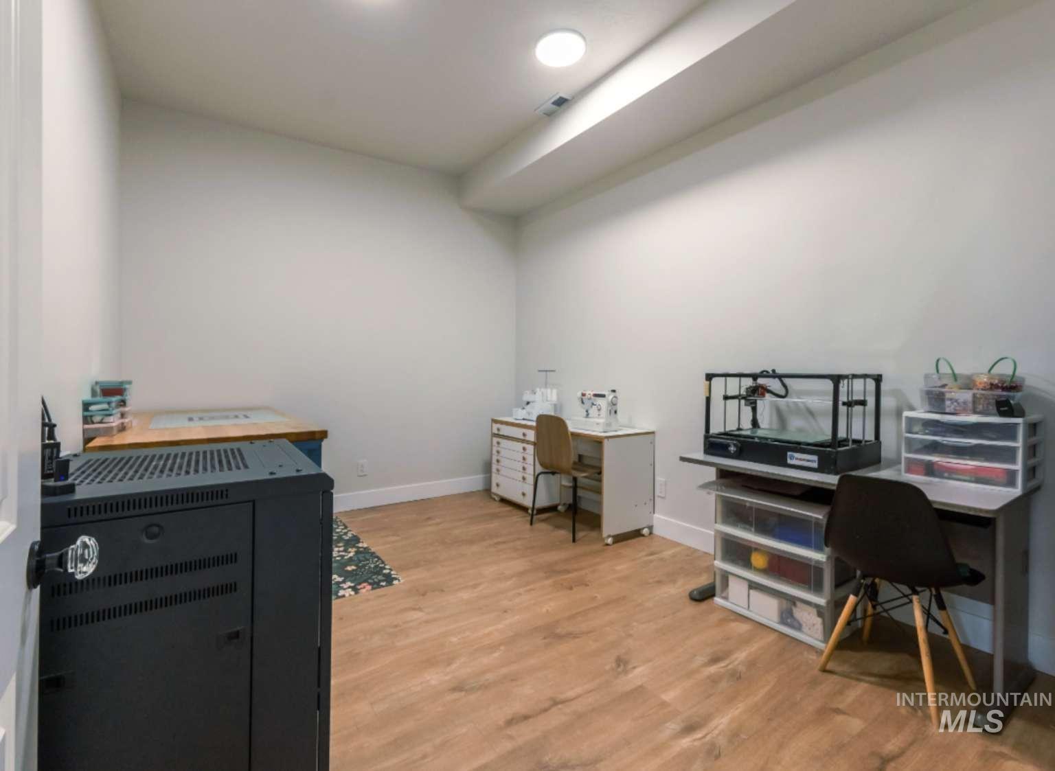9853 Salmon Ridge Place Nampa, ID 83686 - Photo 34 of 48 Office with light wood-type flooring and baseboards