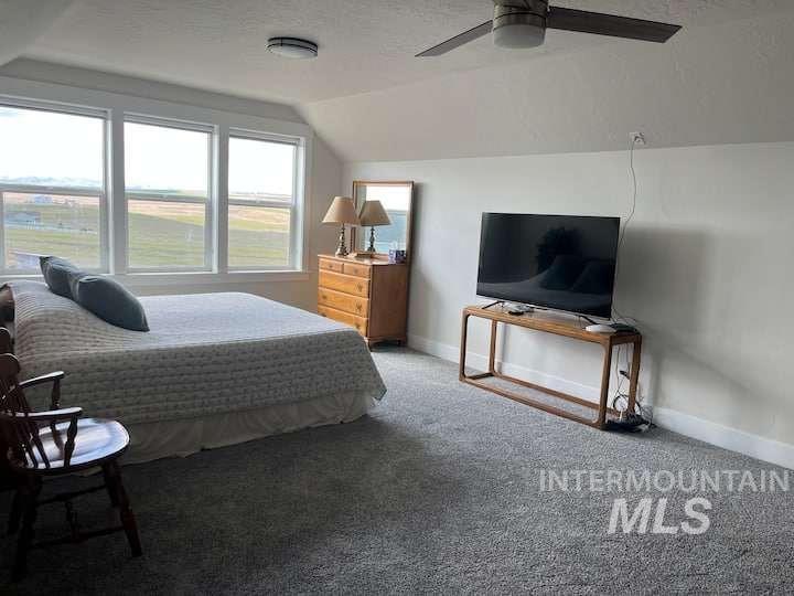 9853 Salmon Ridge Place Nampa, ID 83686 - Photo 39 of 48 Carpeted bedroom with baseboards and ceiling fan