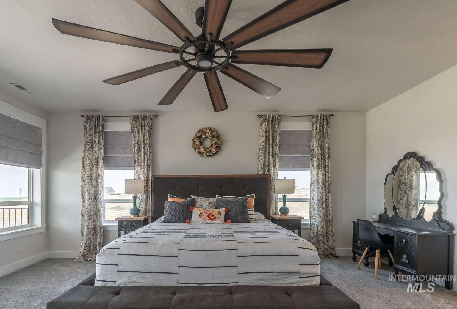 9853 Salmon Ridge Place Nampa, ID 83686 - Photo 9 of 48 Bedroom featuring carpet and a ceiling fan