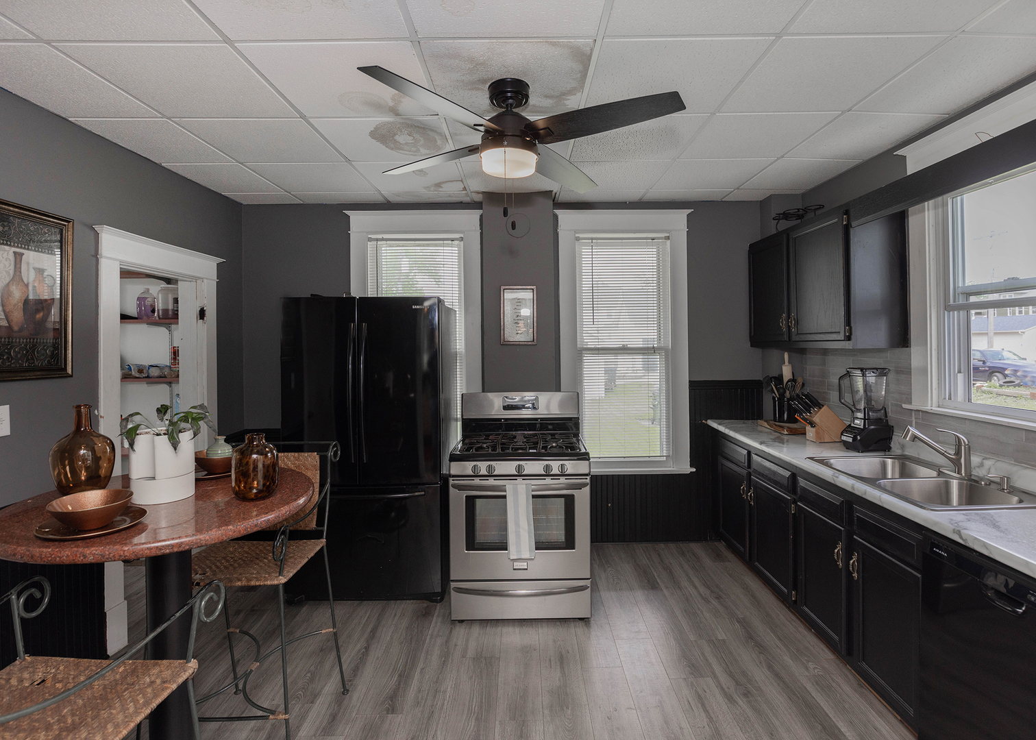 1839 15th Street Moline, IL 61265 - Photo 18 of 32 a kitchen with granite countertop stainless steel appliances a sink cabinets a counter space and a window