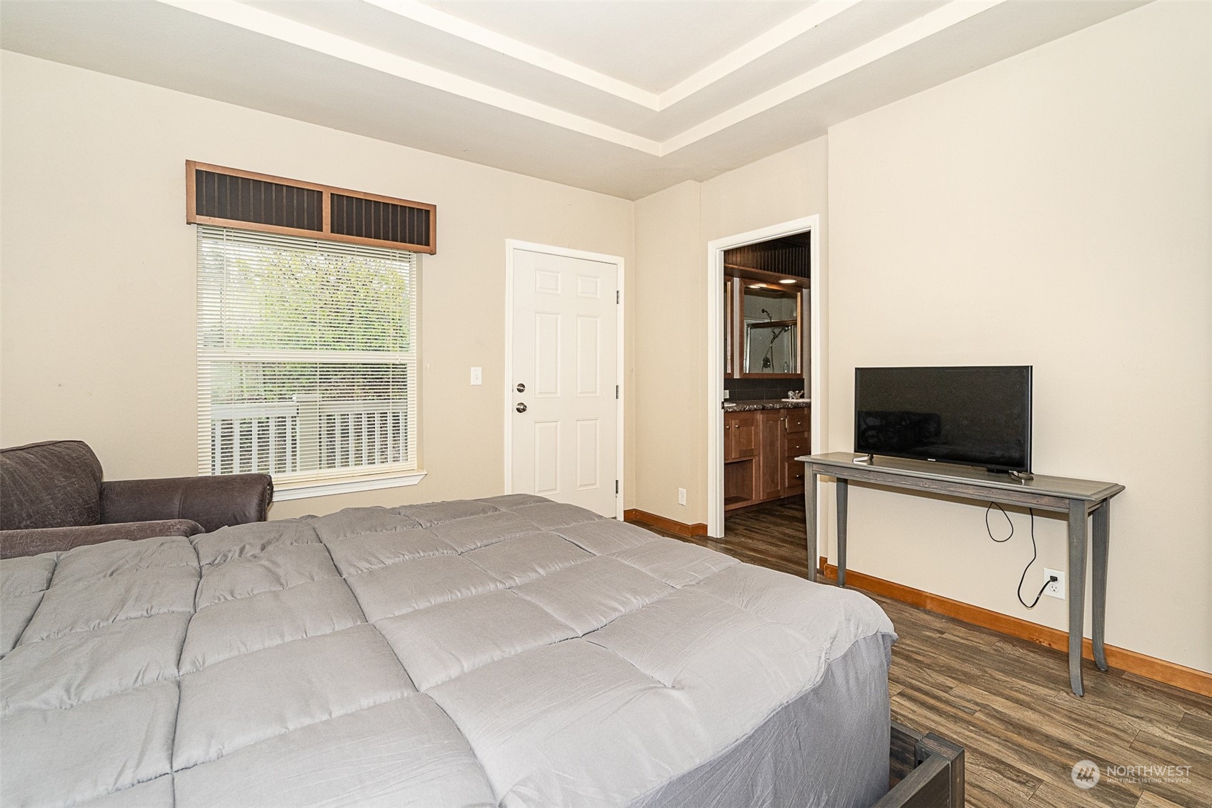 1101 South Scheuber Road, Unit 24 Centralia, WA 98531 - Photo 21 of 29 a bedroom with a bed and a flat screen tv