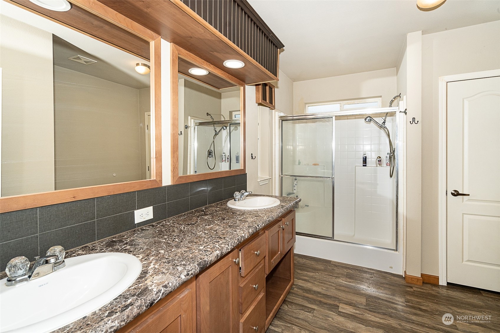 1101 South Scheuber Road, Unit 24 Centralia, WA 98531 - Photo 23 of 29 a bathroom with a granite countertop double vanity sink and mirror