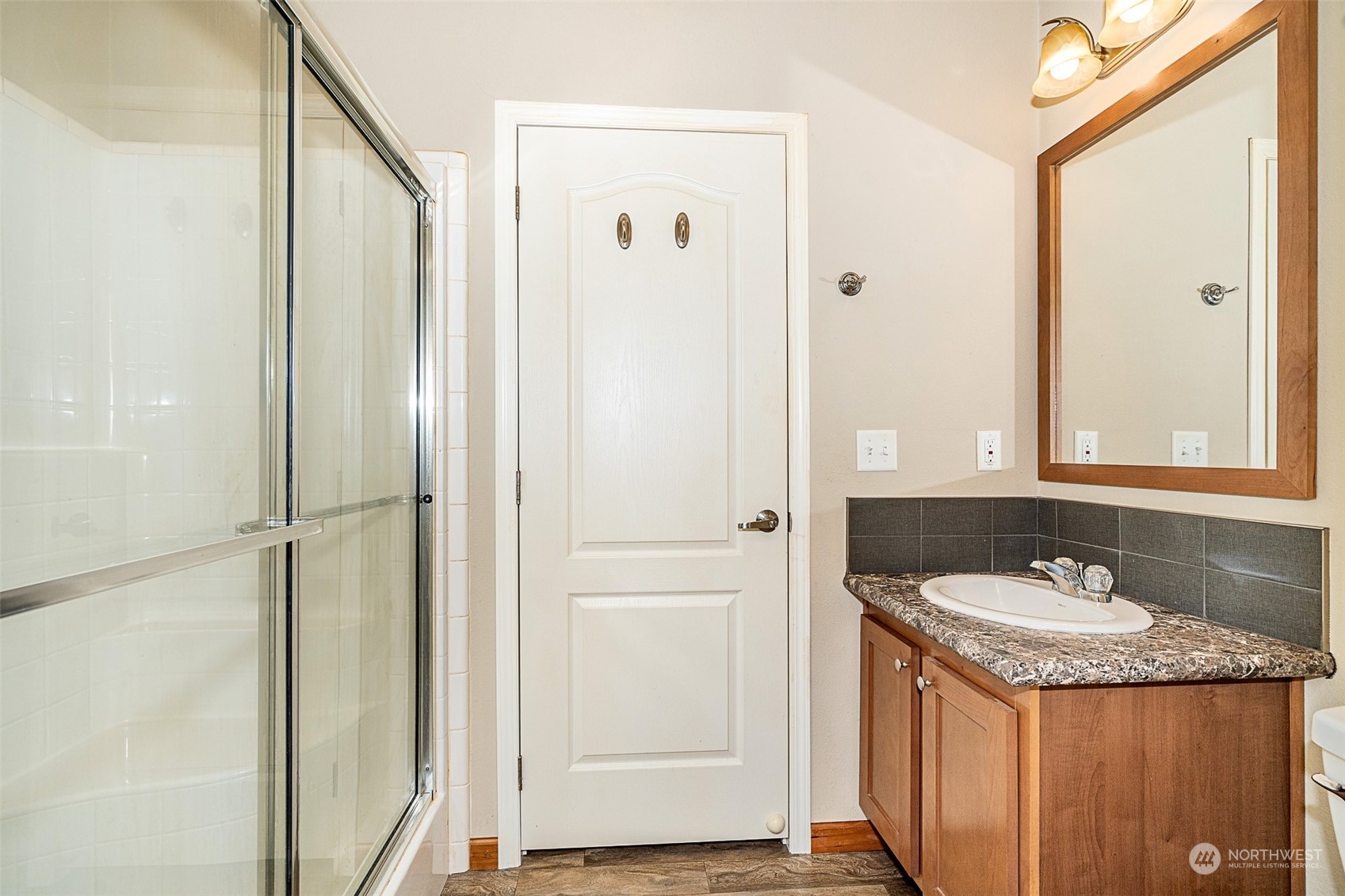 1101 South Scheuber Road, Unit 24 Centralia, WA 98531 - Photo 27 of 29 a bathroom with a sink and a mirror