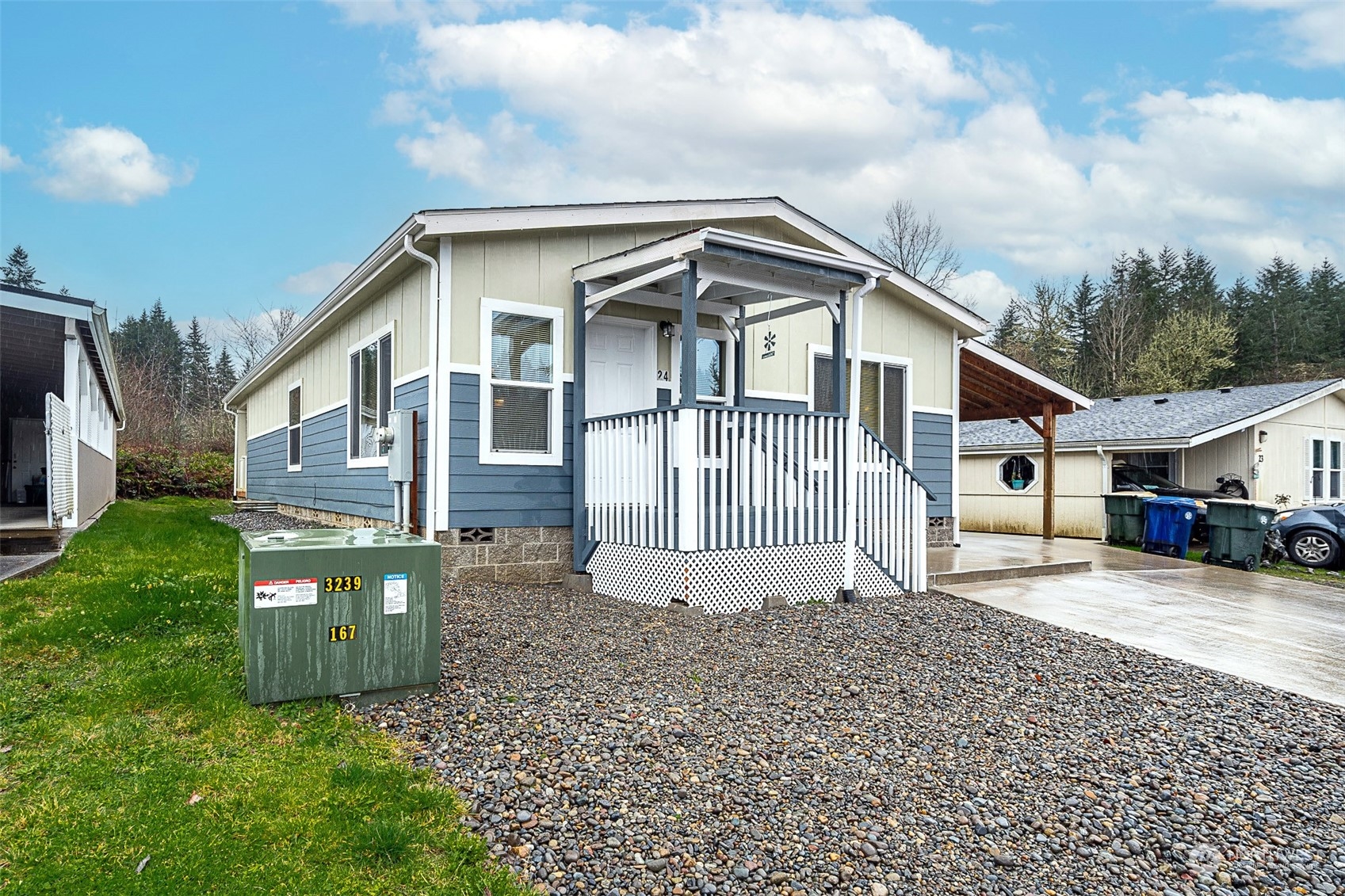 1101 South Scheuber Road, Unit 24 Centralia, WA 98531 - Photo 3 of 29 a front view of a house with a yard and garage