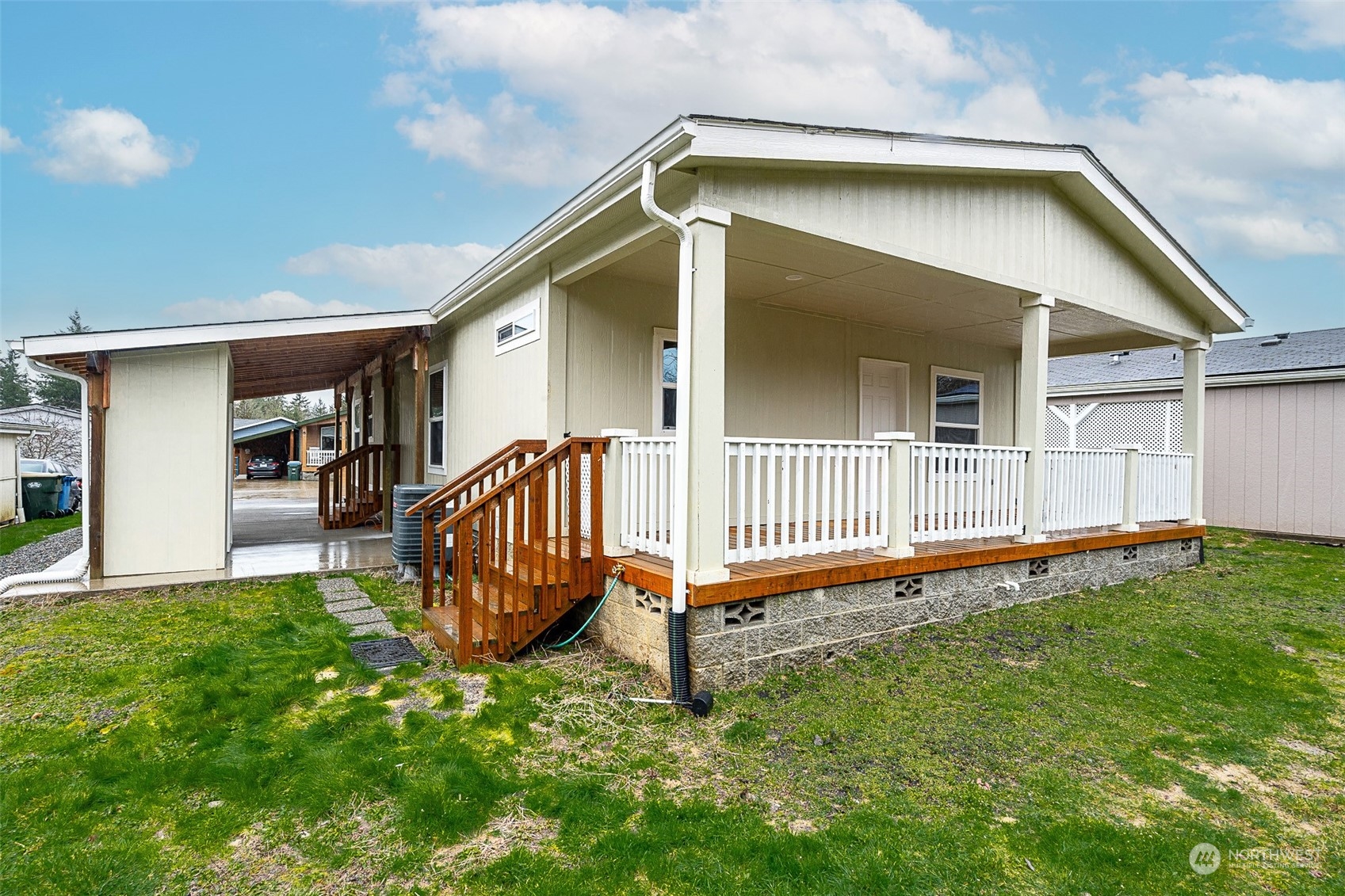1101 South Scheuber Road, Unit 24 Centralia, WA 98531 - Photo 6 of 29 a view of a house with a backyard and a wooden deck