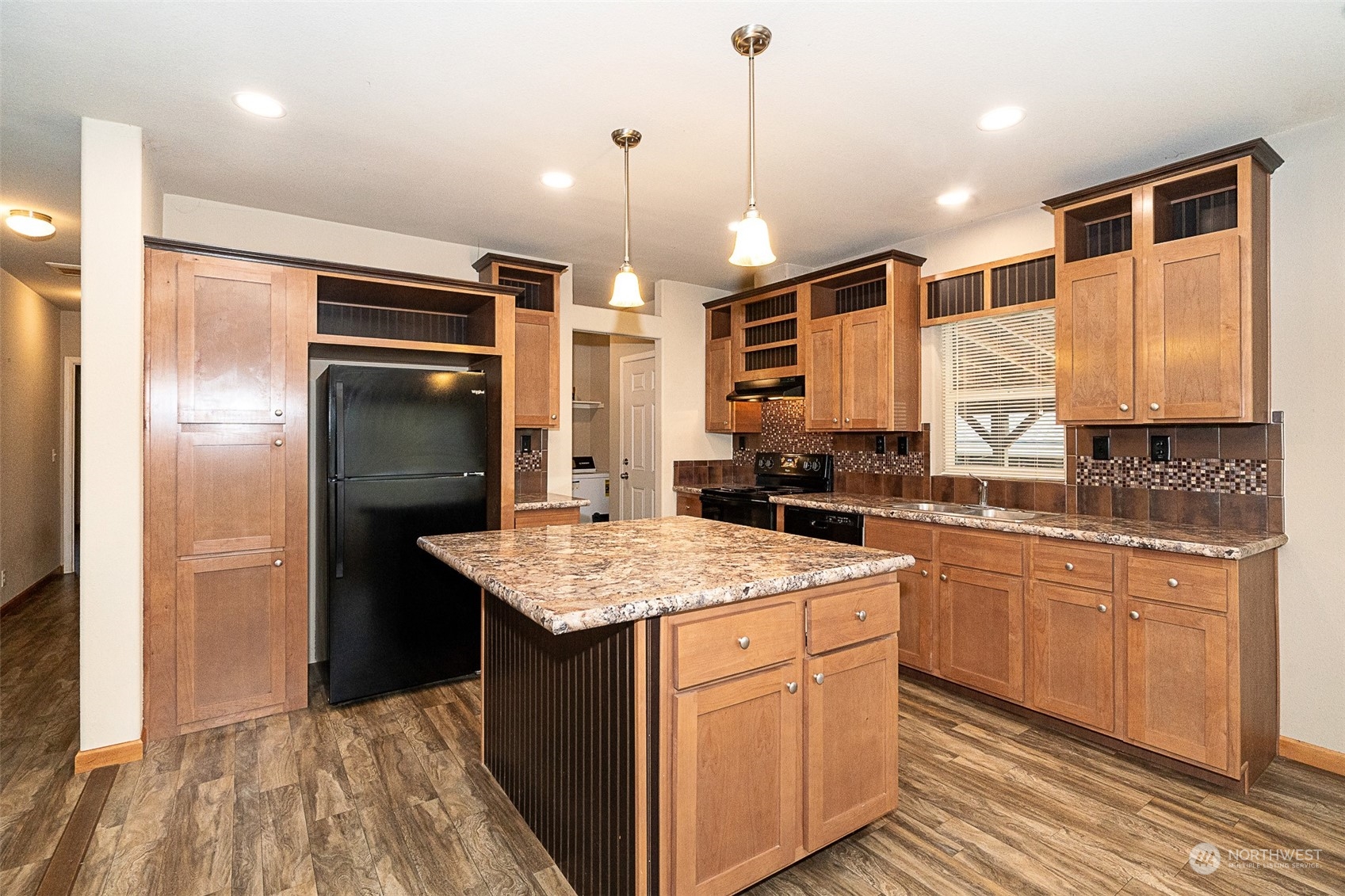 1101 South Scheuber Road, Unit 24 Centralia, WA 98531 - Photo 9 of 29 a kitchen with a refrigerator a sink and wooden cabinets