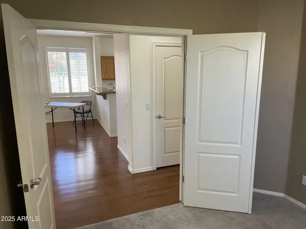 wooden floor with white walls