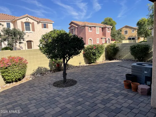 a front view of a house with outdoor seating