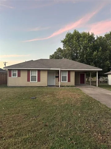 a front view of a house with yard