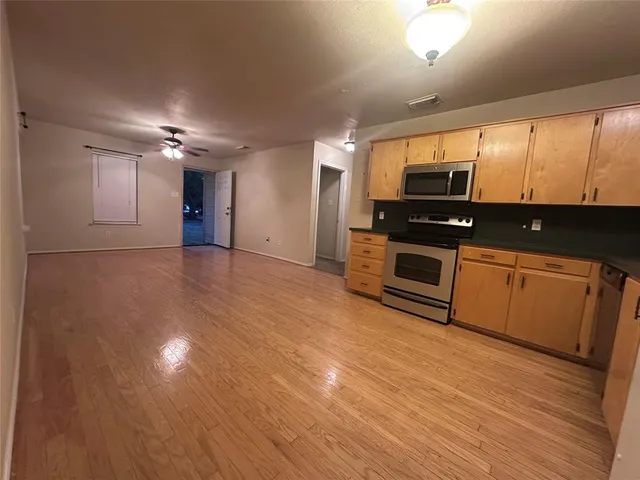 a view of a big yard with a house