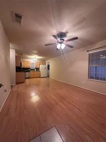 a kitchen with stainless steel appliances a stove top oven a sink and a microwave