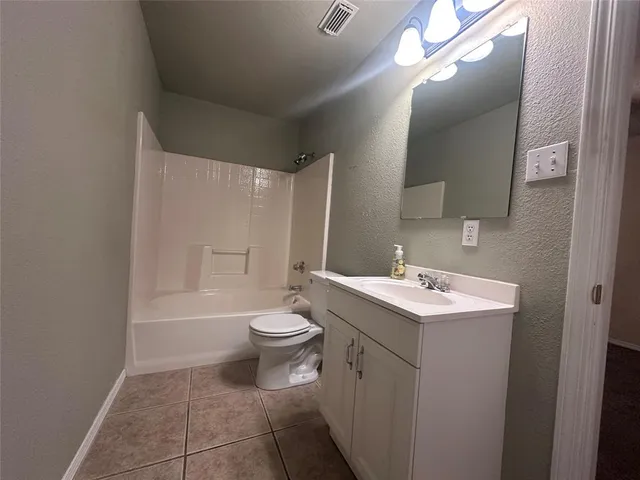 a view of a livingroom with a furniture chandelier fan and a hardwood floor