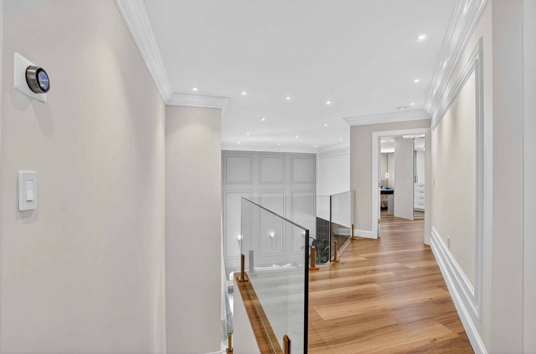 11038 Baybreeze Way Boca Raton, FL 33428 - Photo 34 of 95 a view of a hallway with wooden floor and staircase