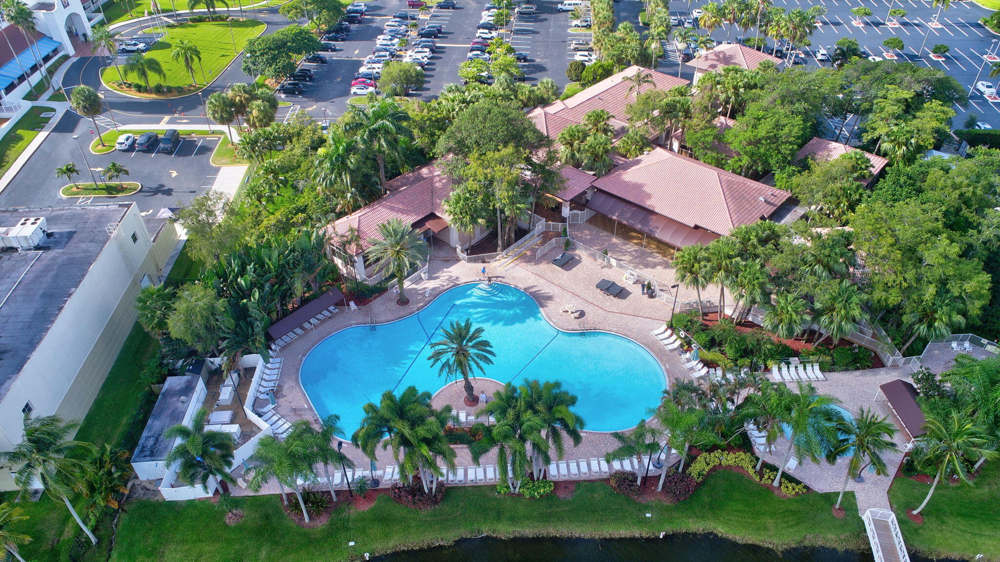 11038 Baybreeze Way Boca Raton, FL 33428 - Photo 4 of 95 an aerial view of a house with a garden and swimming pool