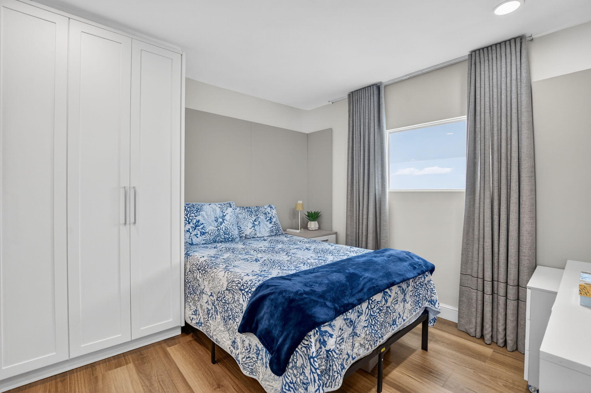 11038 Baybreeze Way Boca Raton, FL 33428 - Photo 50 of 95 a bedroom with a bed and wooden floor