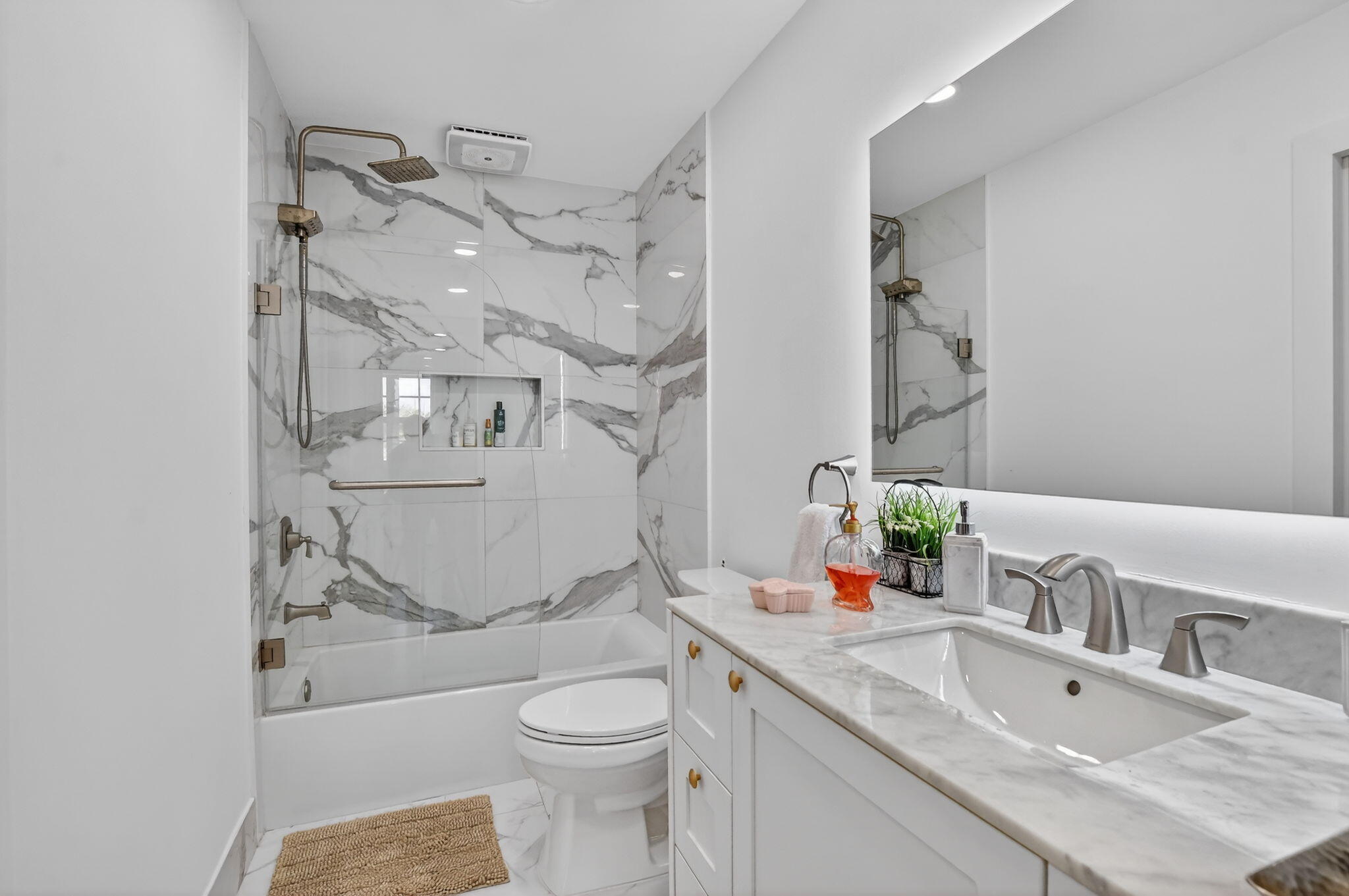 11038 Baybreeze Way Boca Raton, FL 33428 - Photo 57 of 95 a bathroom with a granite countertop toilet sink and mirror