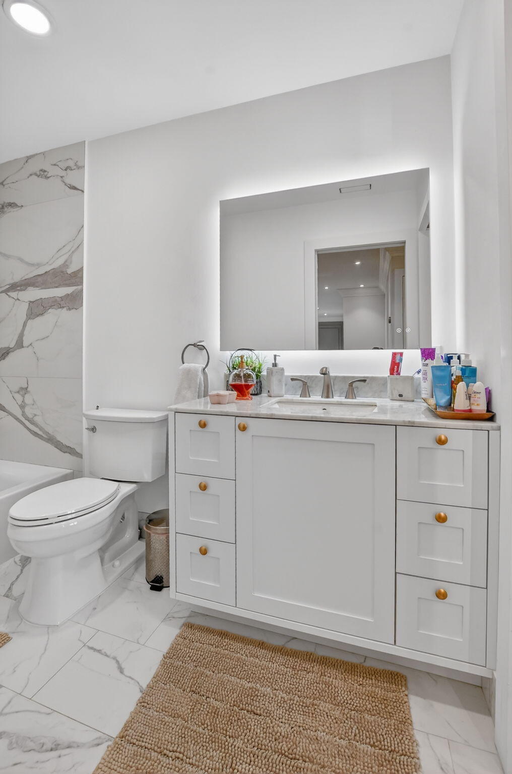 11038 Baybreeze Way Boca Raton, FL 33428 - Photo 59 of 95 a bathroom with a sink toilet vanity and tub