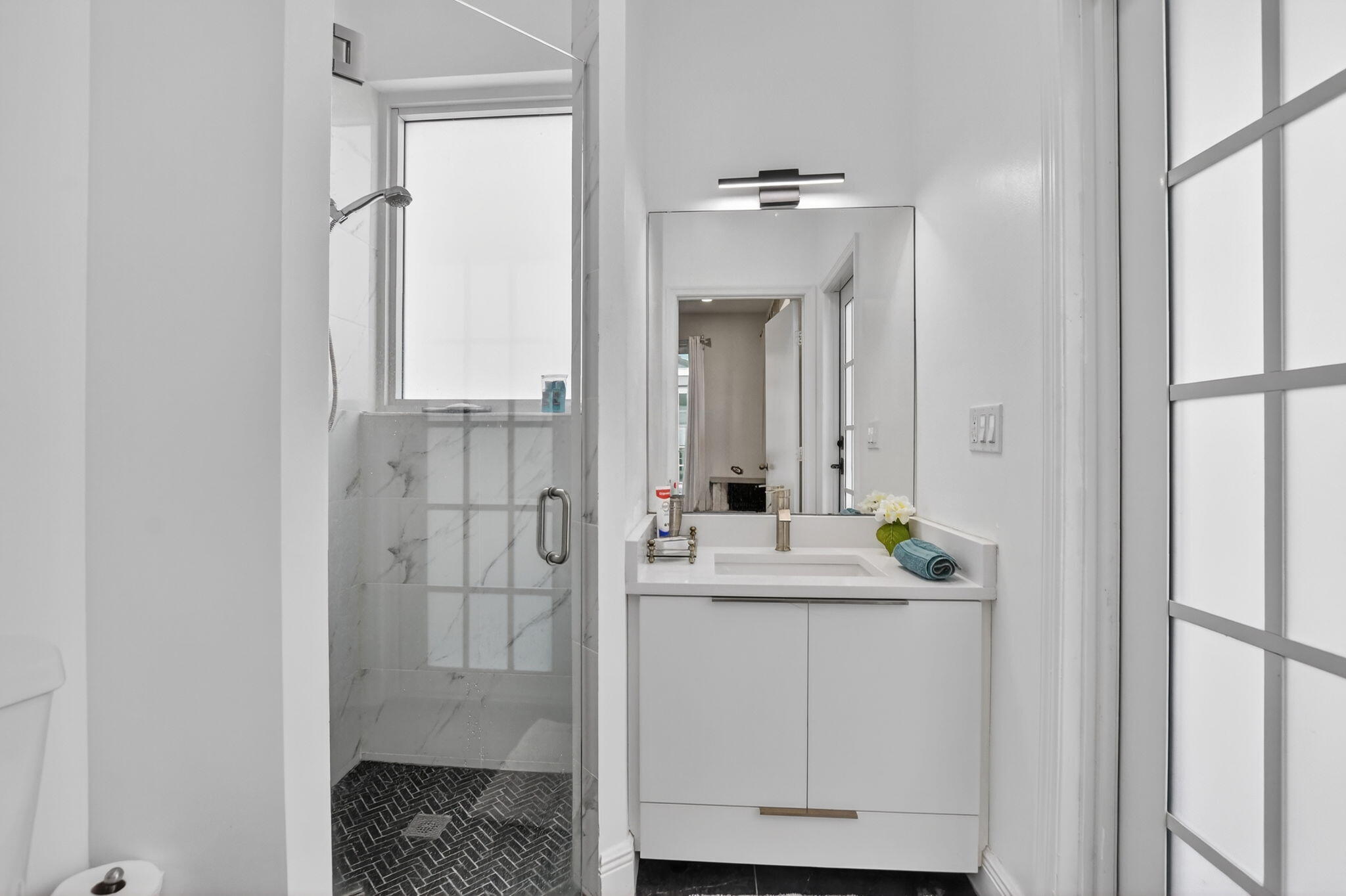11038 Baybreeze Way Boca Raton, FL 33428 - Photo 68 of 95 a en suite bathroom with a granite countertop sink and a mirror