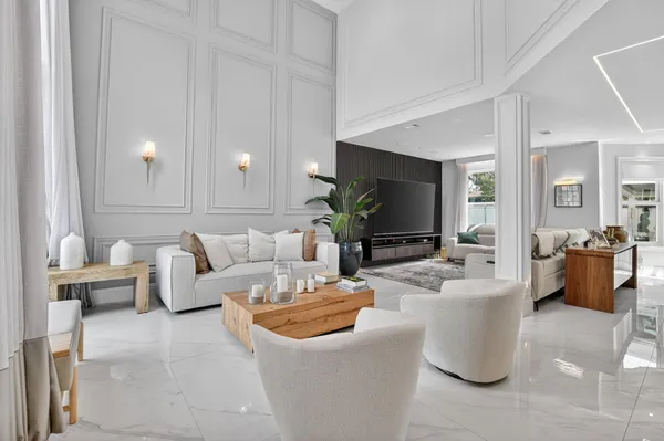 a living room with fireplace furniture and a flat screen tv