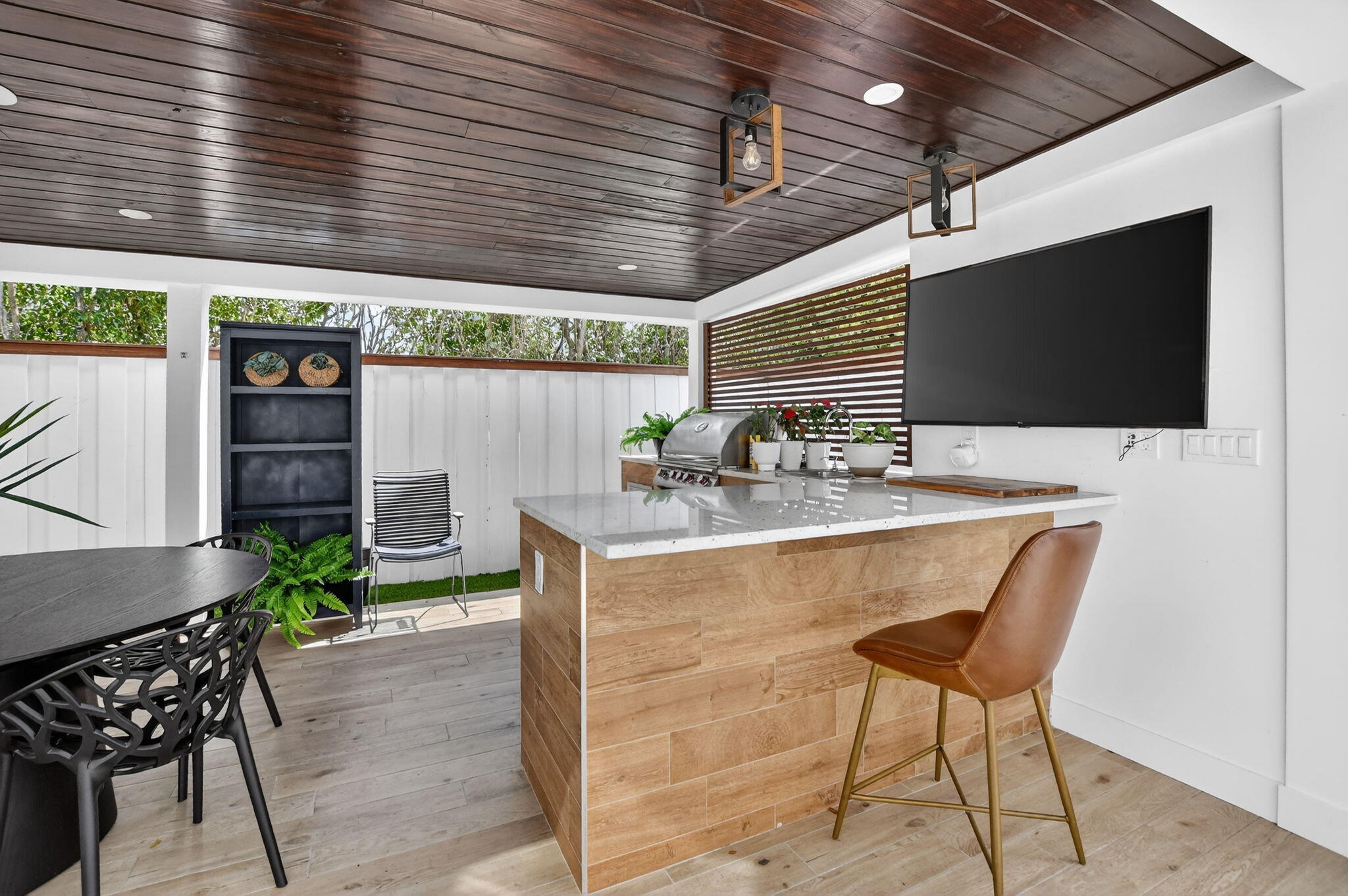 11038 Baybreeze Way Boca Raton, FL 33428 - Photo 71 of 95 a kitchen with a table chairs and a barbeque