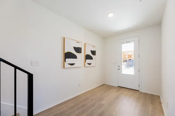 a bedroom with a bed and a potted plant