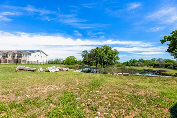 a view of a lake with a big yard