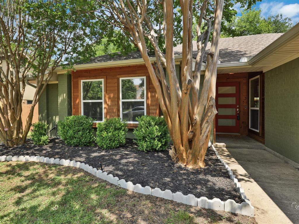 3054 Rambling Drive Dallas, TX 75228 - Photo 1 of 1 a front view of a house with garden
