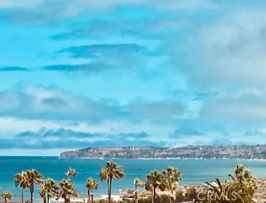 a view of a lake with houses in the back