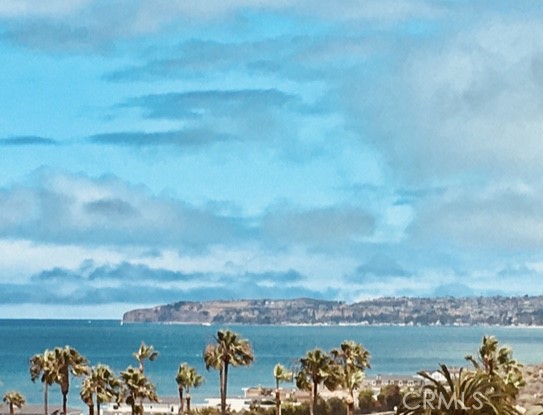 1541 Buena Vista, Unit 1 San Clemente, CA 92672 - Photo 1 of 17 a view of a lake with houses in the back