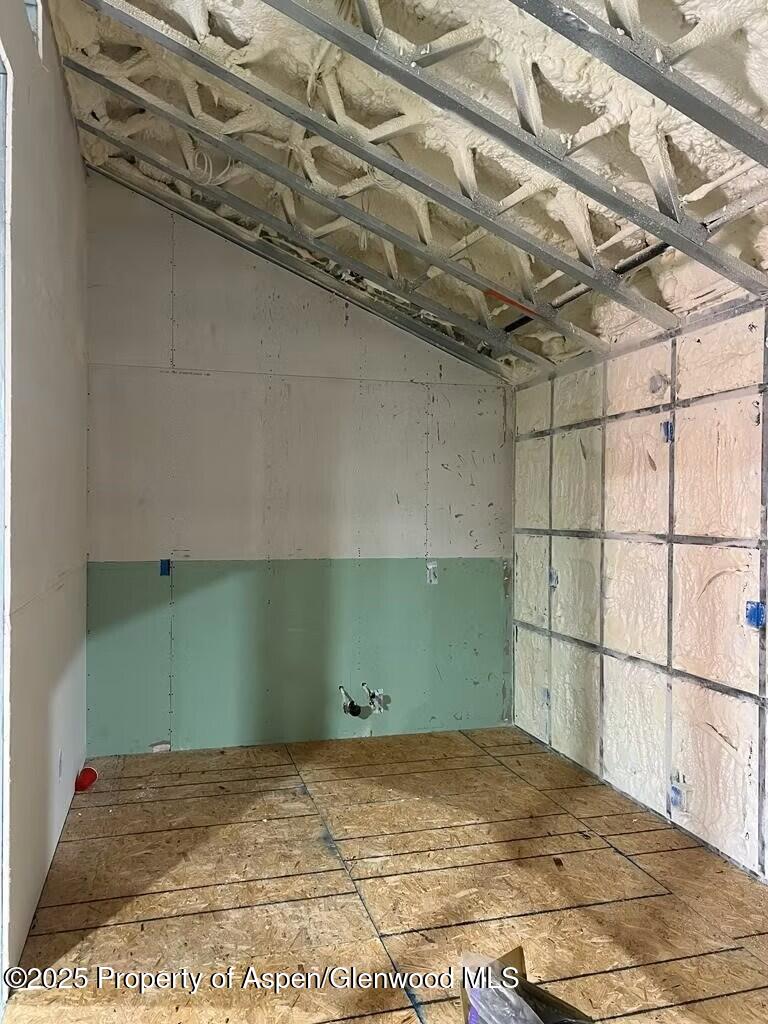 Tbd 14th Street Rifle, CO 81650 - Photo 14 of 14 a view of a room with a wooden floor and a wooden bench