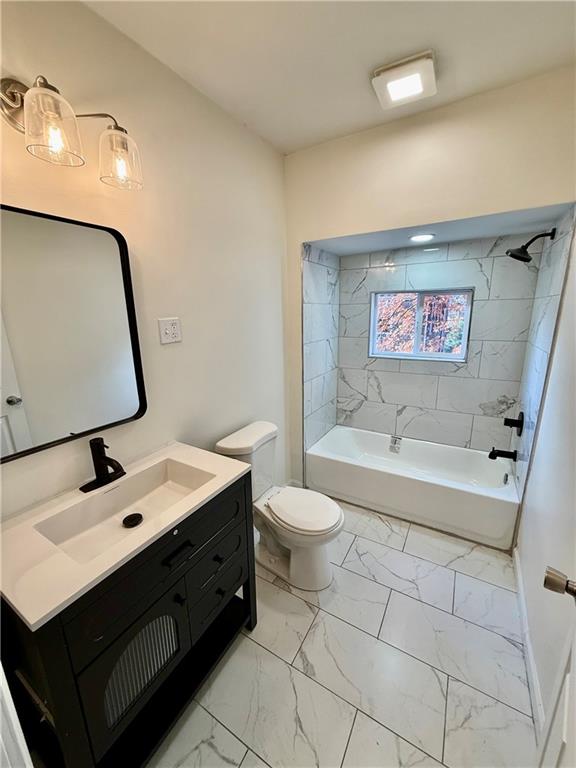 1407 Monterey Street Pittsburgh, PA 15212 - Photo 11 of 16 a bathroom with a sink mirror vanity and toilet