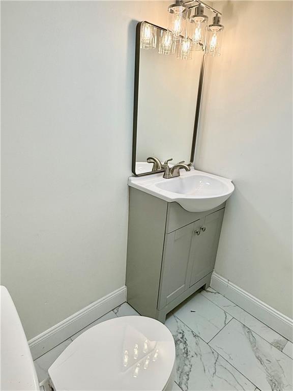 1407 Monterey Street Pittsburgh, PA 15212 - Photo 14 of 16 a bathroom with a sink and a mirror