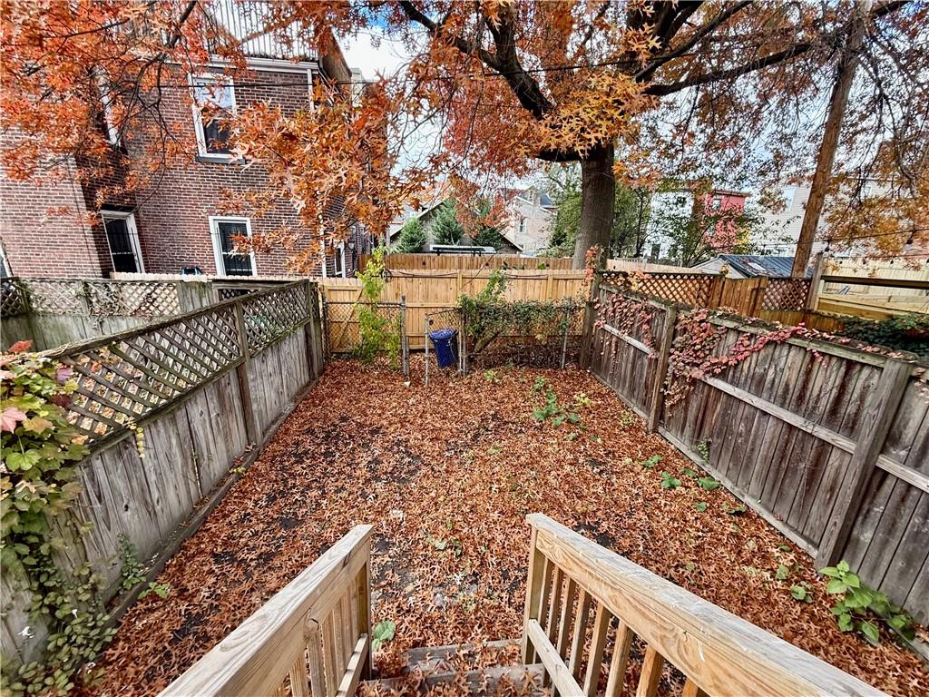 1407 Monterey Street Pittsburgh, PA 15212 - Photo 7 of 16 a view of a pathway with a wrought iron fence