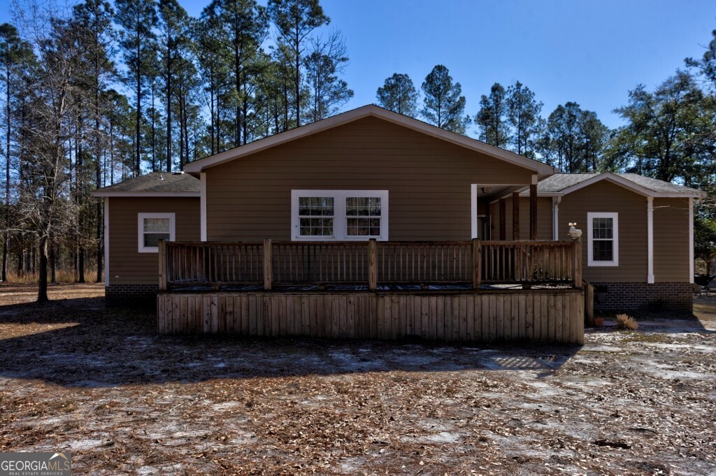 1401 Messex Road Millen, GA 30442 - Photo 11 of 51 a view of a house with wooden fence