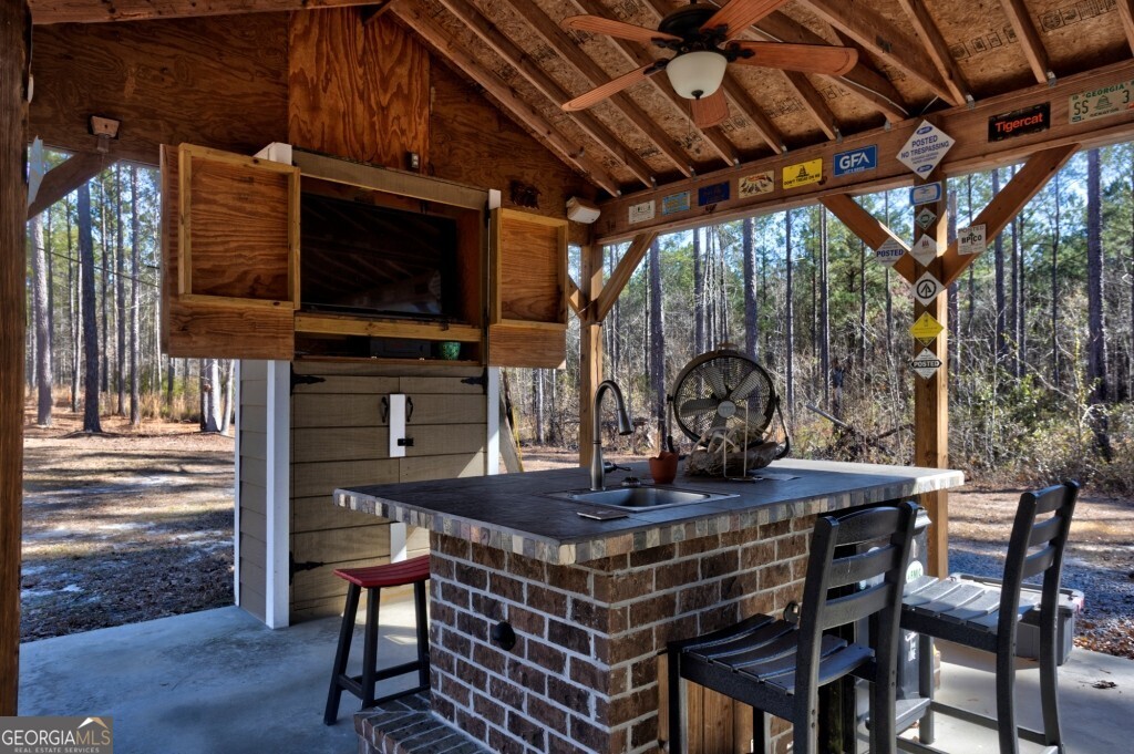 1401 Messex Road Millen, GA 30442 - Photo 15 of 51 a view of a chairs and table in the patio